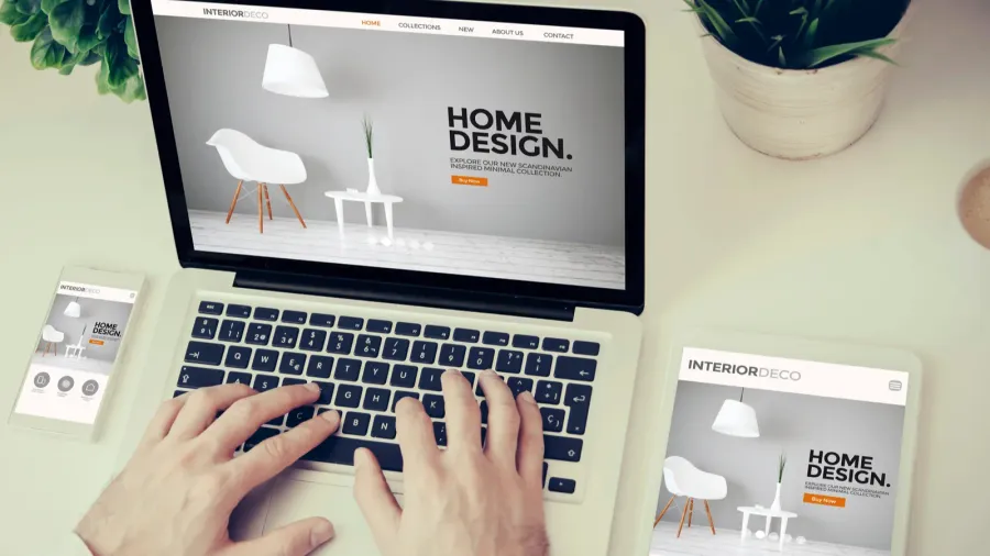 man using devices with design website