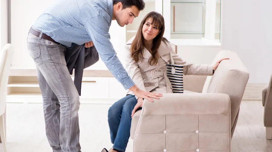 married couple in the shop choosing furniture