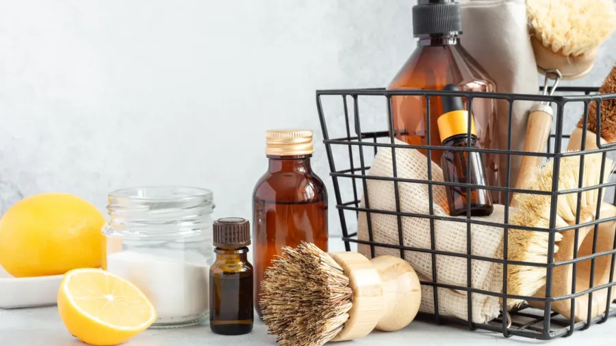 metal basket with natural cleaning products and tools bamboo accessories