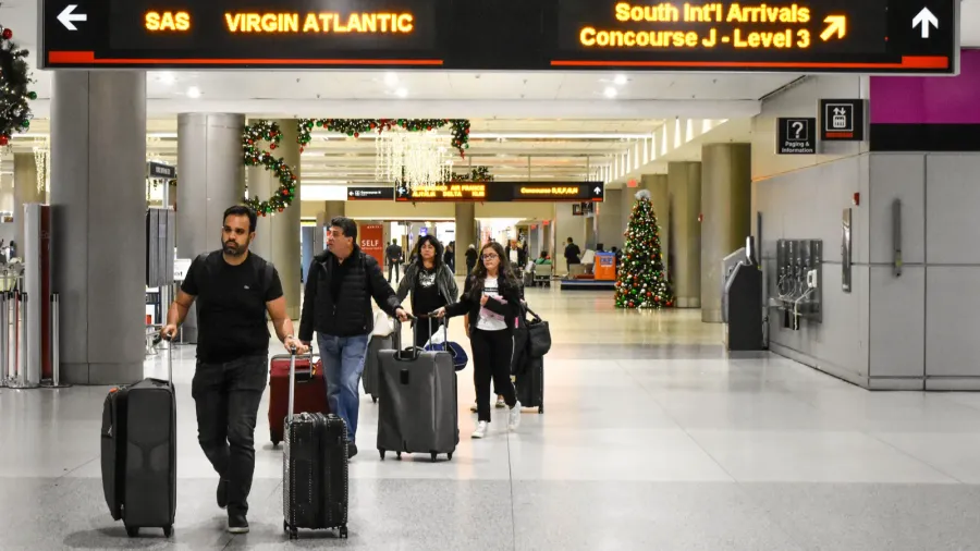 miami florida january 05 2019 people walking with suitcases at
