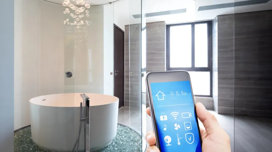 mobile phone with smart home app in modern bathroom