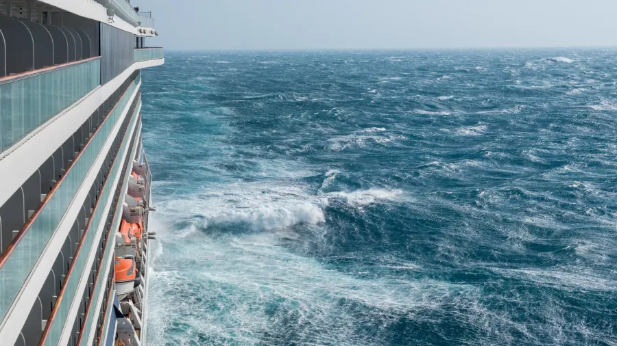 modern cruise ship traveling through rough seas