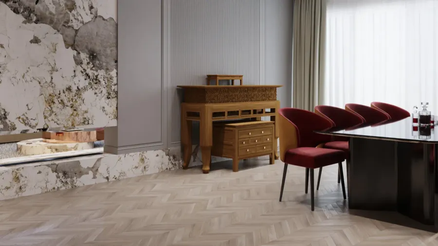 Modern dining room with herringbone wood flooring, red velvet chairs, and wooden console.