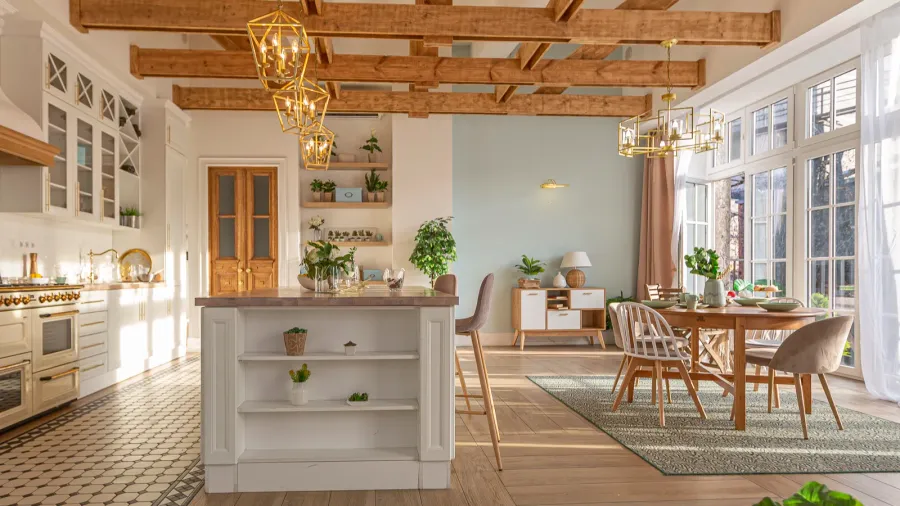 A bright kitchen and dining area featuring wooden beams, modern fixtures, and lots of greenery.