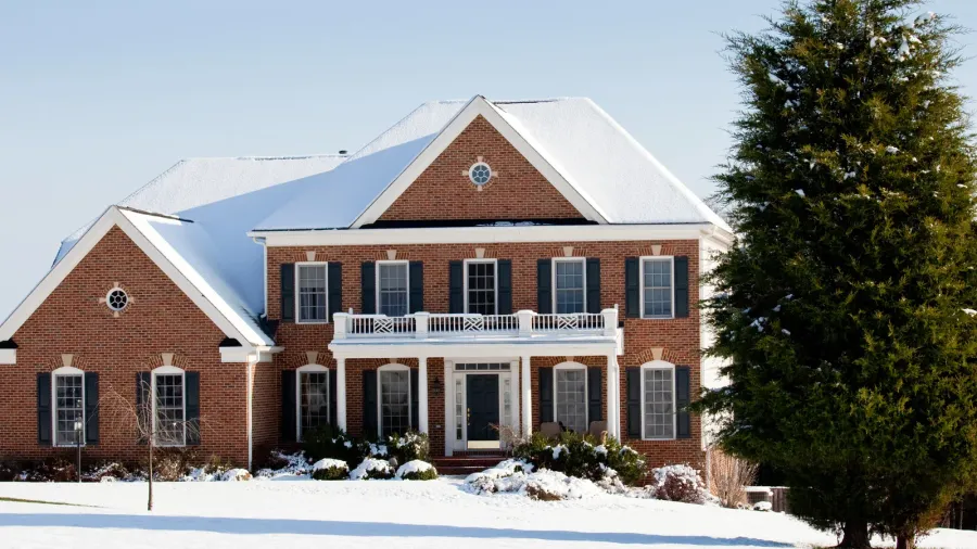 modern single family home in snow