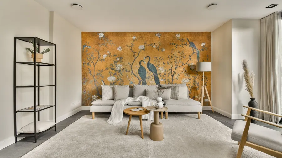 A living room with a large floral and bird wall mural.