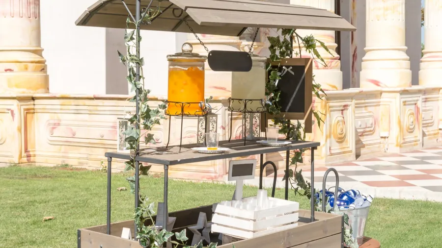 nice drink cart with lemonade and orangeade decorating a garden