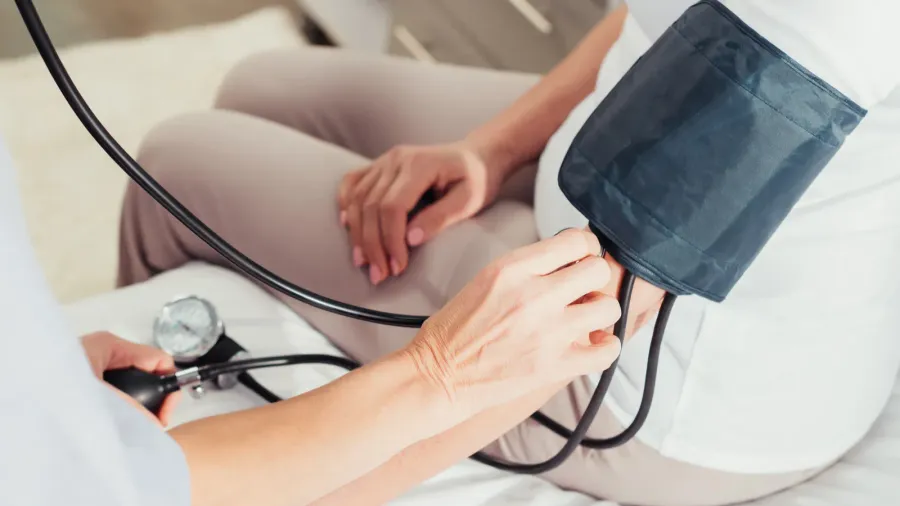 nurse measuring blood pressure to patient