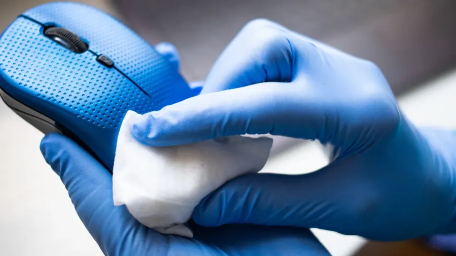 office sanitizing wipe wiping mouse and mousepad with disinfecting wipes