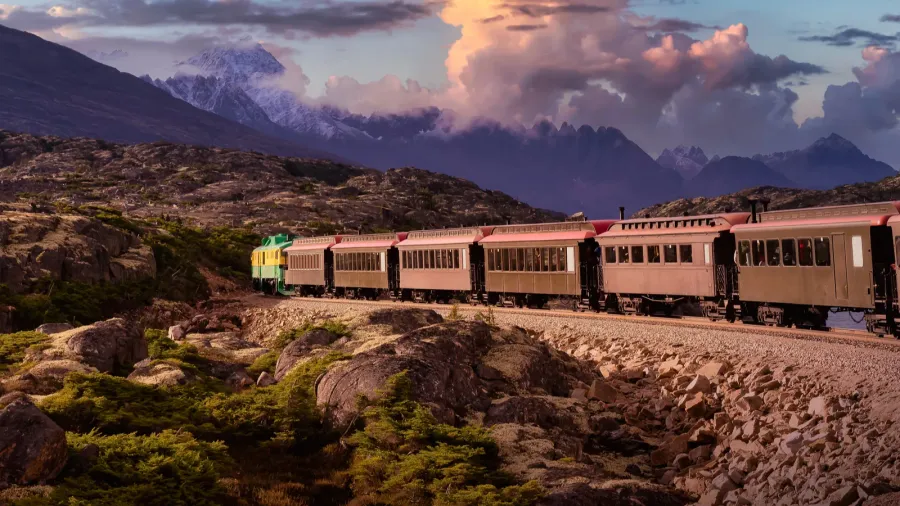 old historic railroad train is going over white pass dramatic