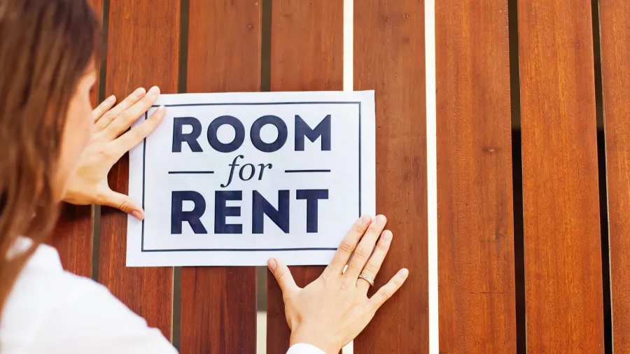 owner hanging up sign