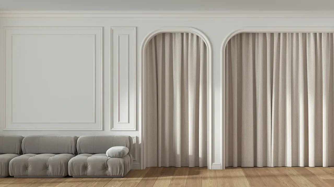 Panoramic view of classic living room with molded and arched wall.
