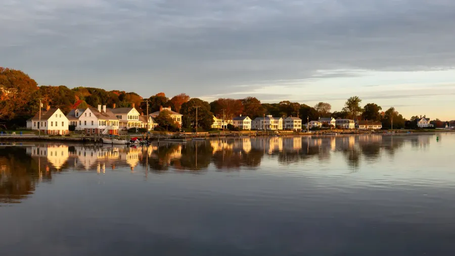 panoramic view of residential homes by the mystic river during