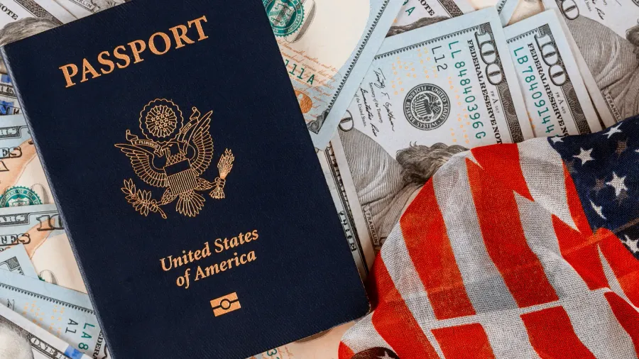patriotic american passport on top of a pile of one