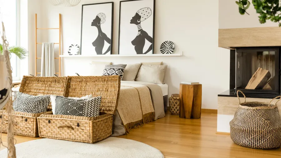 Elegant bedroom with a wooden bed, framed art pieces, and bright, airy ambiance.