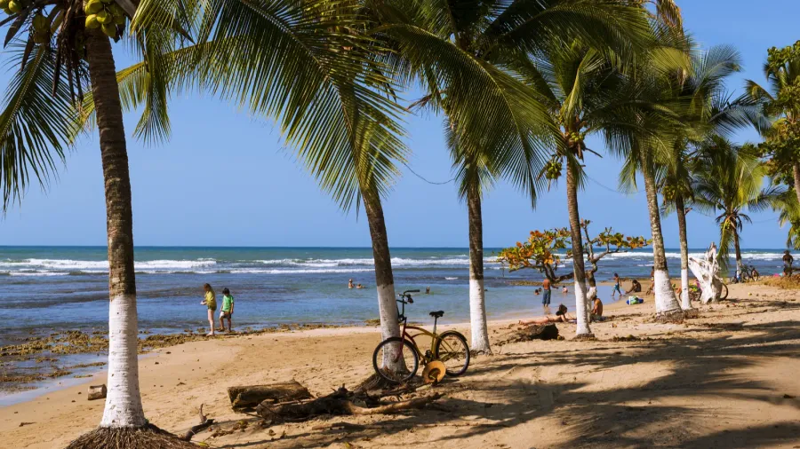 people at the beach in puerto viejo de talamanca in