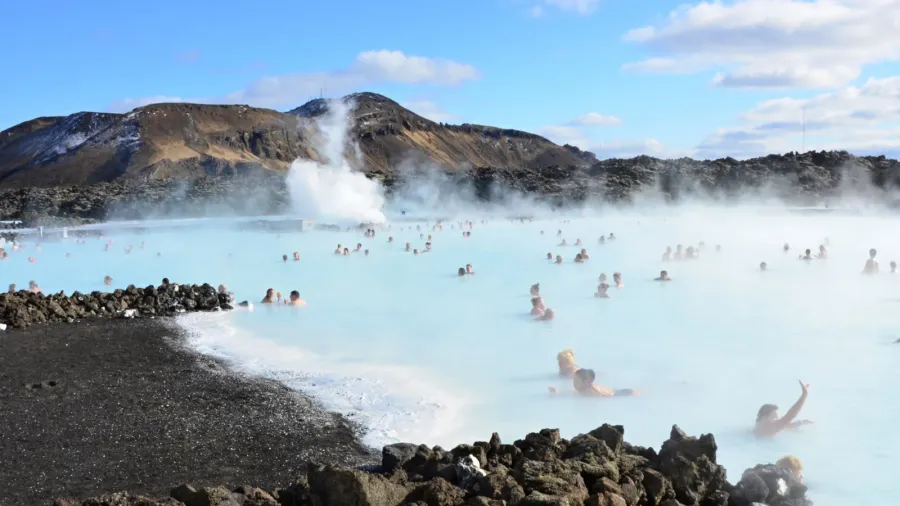 people bathing in the blue lagoon in iceland