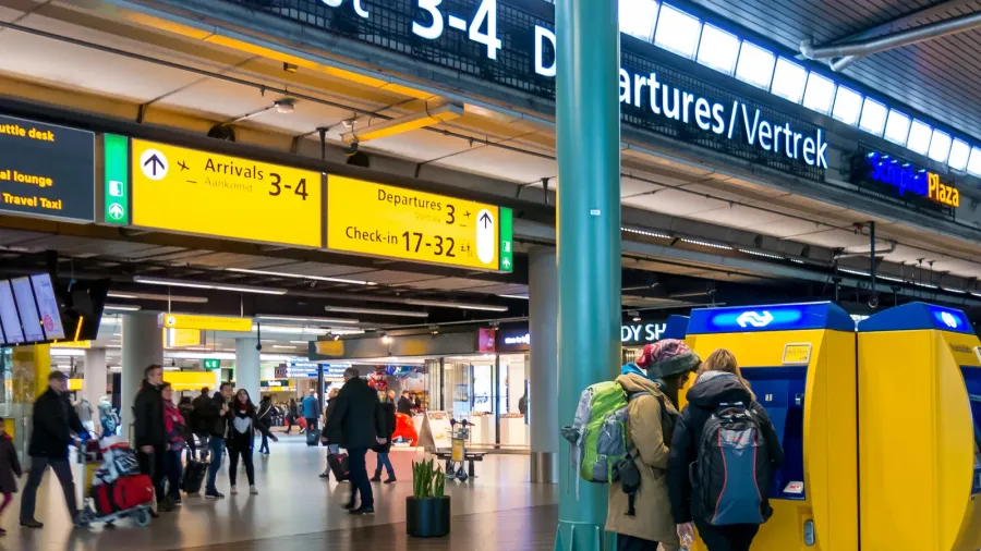 people in railway terminal at schiphol amsterdam airport hollan