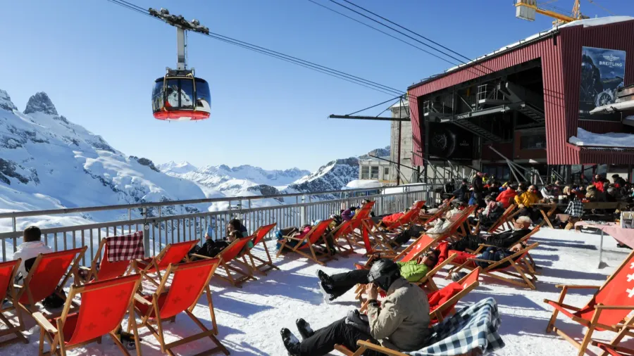 people relaxing at the restaurant on the swiss alps