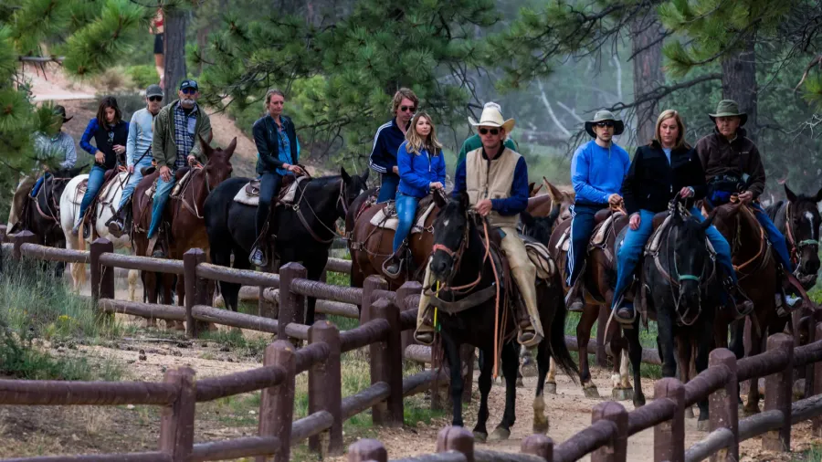 people riding on horses on the hiking trails in bryce