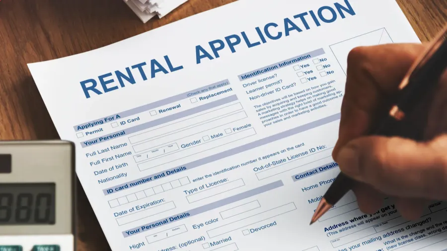 person filling application form