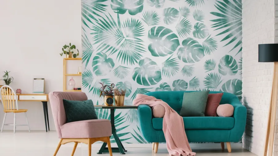 pink armchair and blue settee in living room interior with