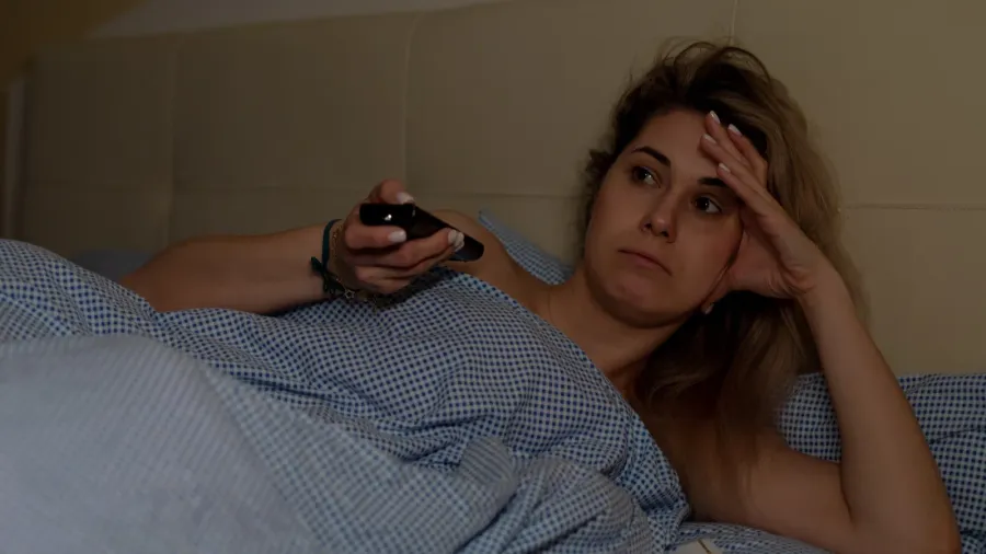 portrait of young tired exhausted sad woman with long fair