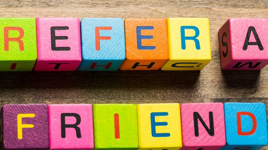 refer tablet pc with text refer a friend with blue