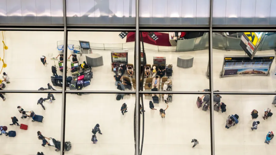 reflection glass of top view people in line queue with