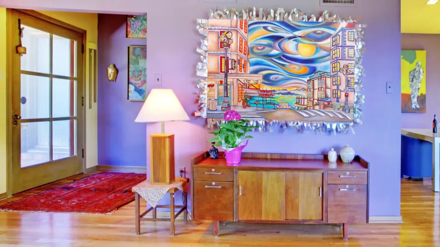 An artistic entryway showcases vibrant colors, unique decor, and a welcoming atmosphere.