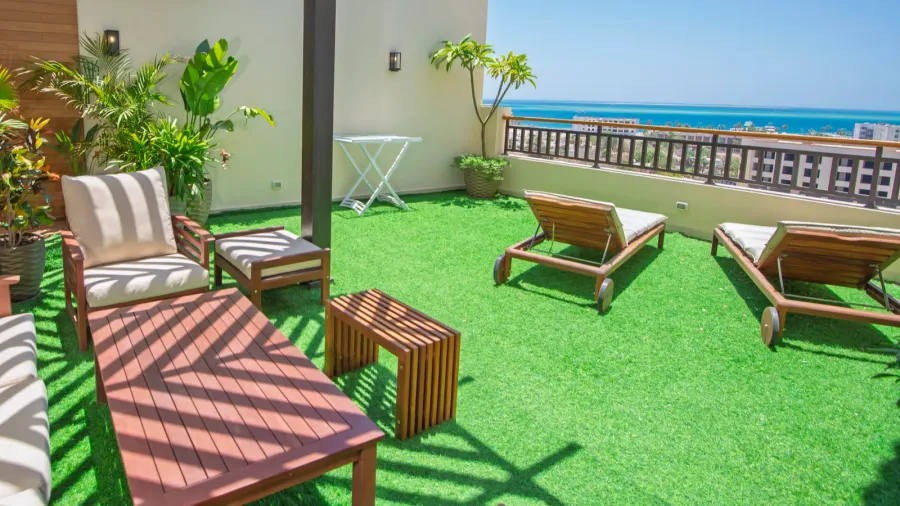 roof terrace area with seating and sea view on top