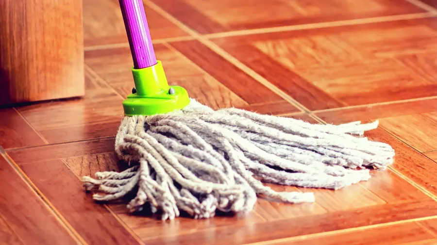 rope mop for cleaning the floor is on the floor