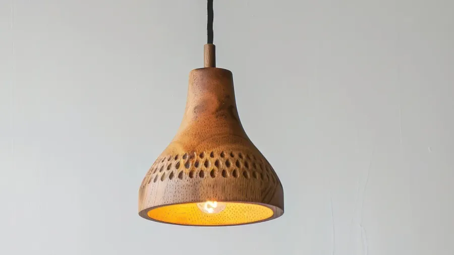 rustic hanging lamp with intricate patterns casting warm light against