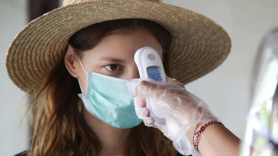 safety measures during coronavirus infrared thermometer measure body temperature from