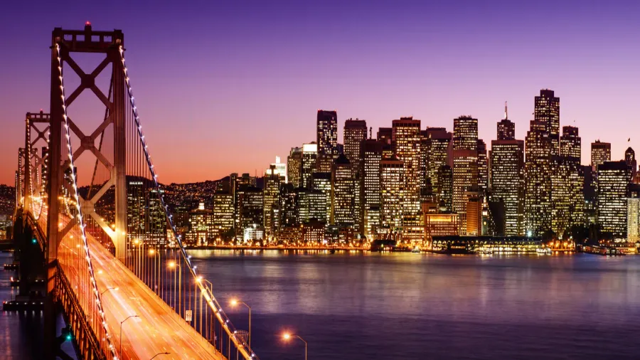 san francisco skyline and bay bridge at sunset california