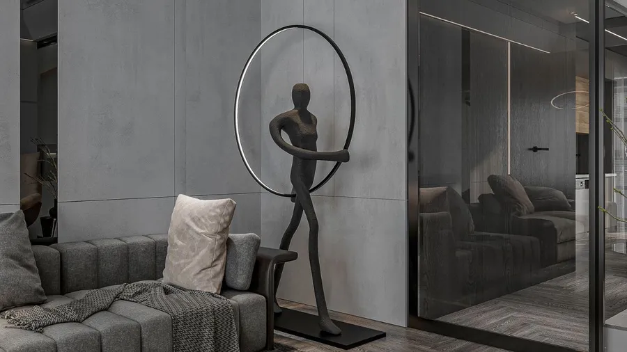 Modern sculpture of a woman with a circular frame, placed in a living room corner.