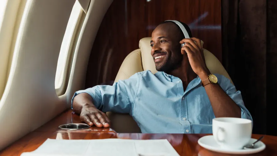 selective focus of happy african american man listening music in