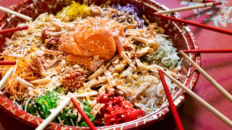 serving of yusheng or yee sang with raw salmon belly