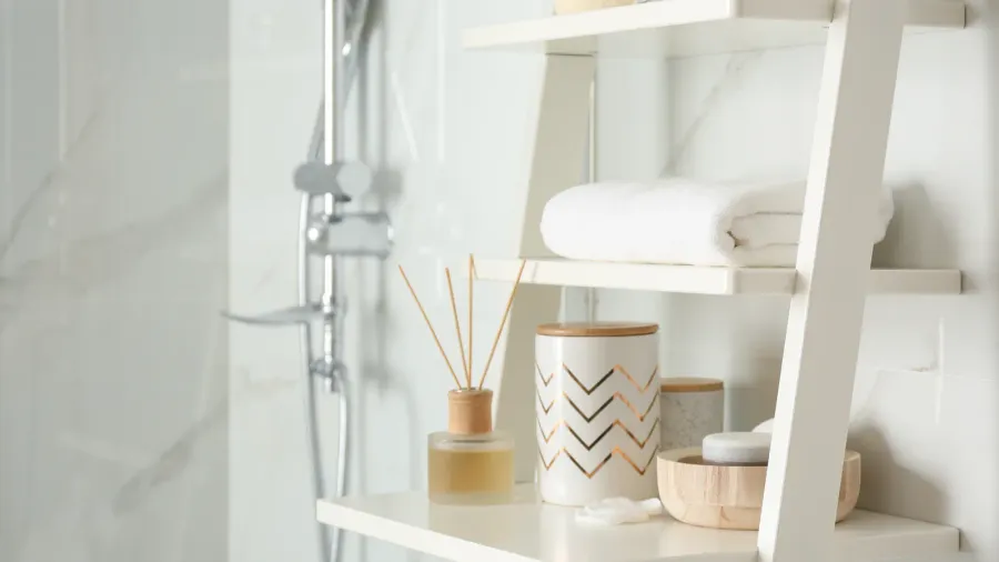 shelving unit with different items in bathroom interior