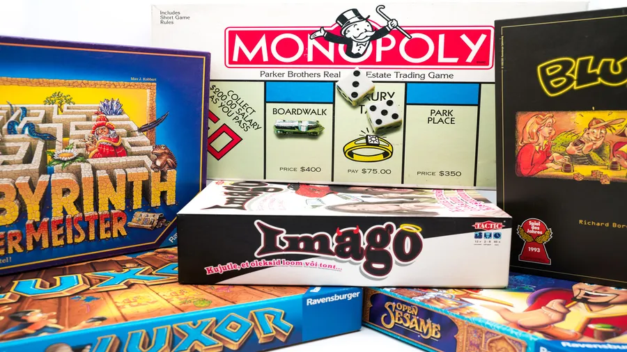 Different board game boxes stacked up.