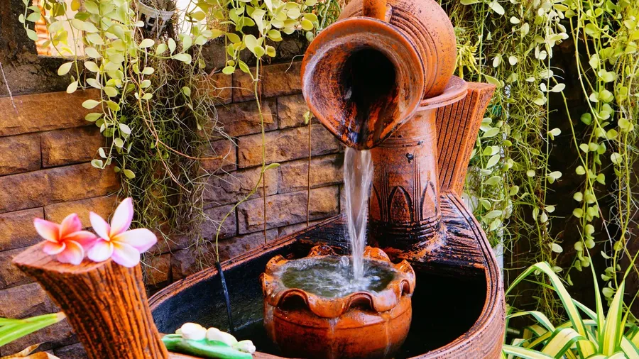 A beautiful rustic fountain in a garden.