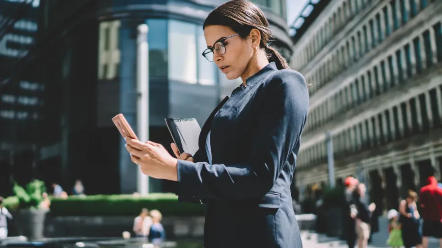 side view of serious female in formal wear and glasses