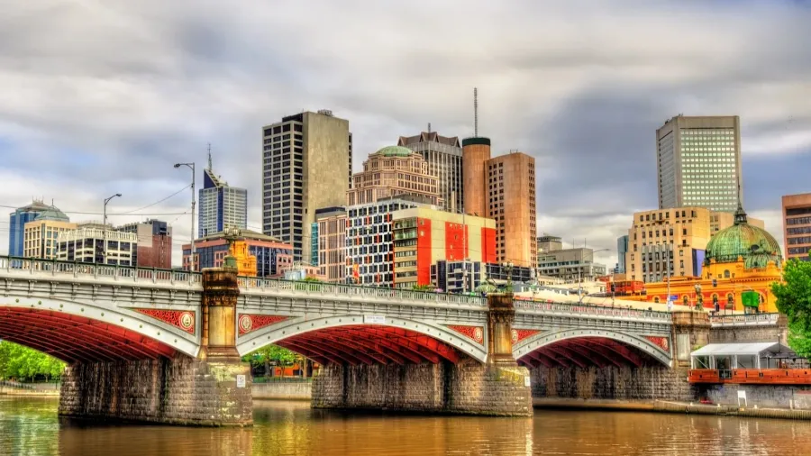 skyline of melbourne along the yarra river and princes bridge