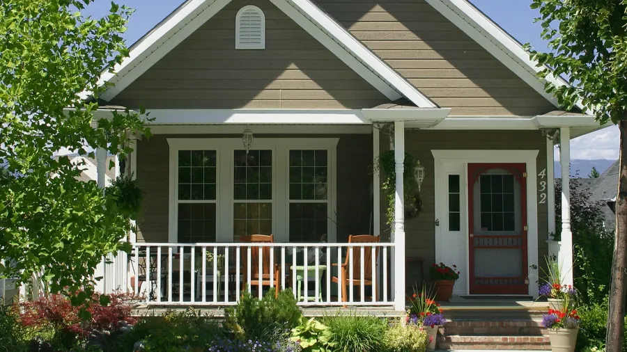 small cozy home with beautiful landscaping