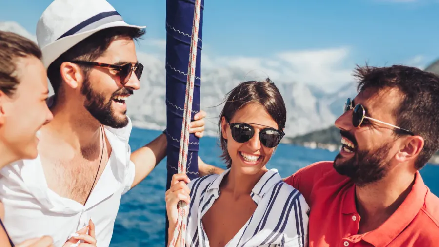 smiling friends sailing on yacht  vacation travel sea friend