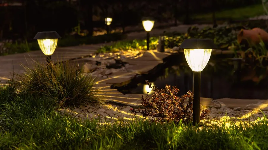 Solar lantern stakes along the pathway in the garden.
