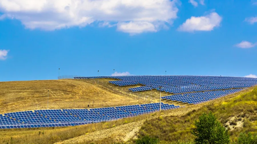 solar panels in a hilly landscape