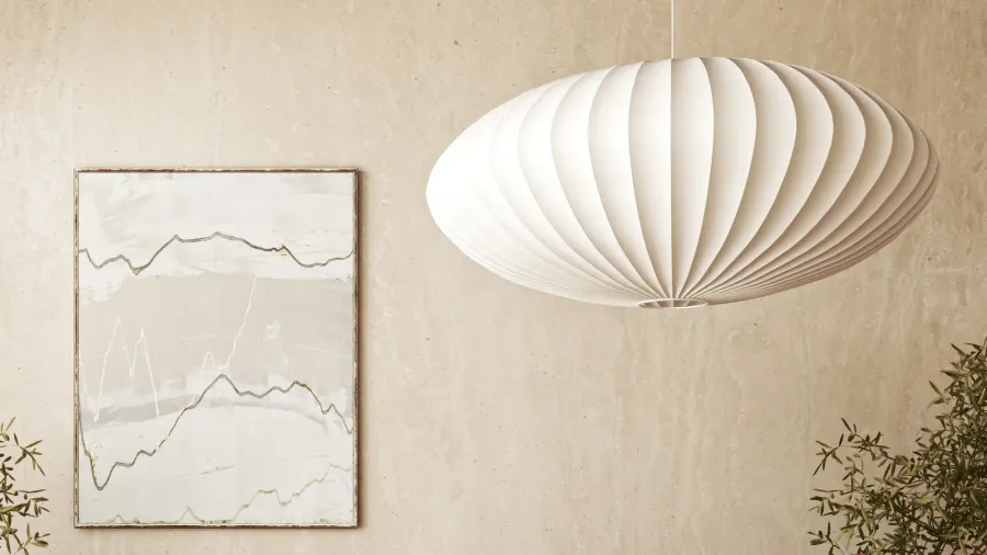 A sculptural white pendant light hanging from the ceiling.
