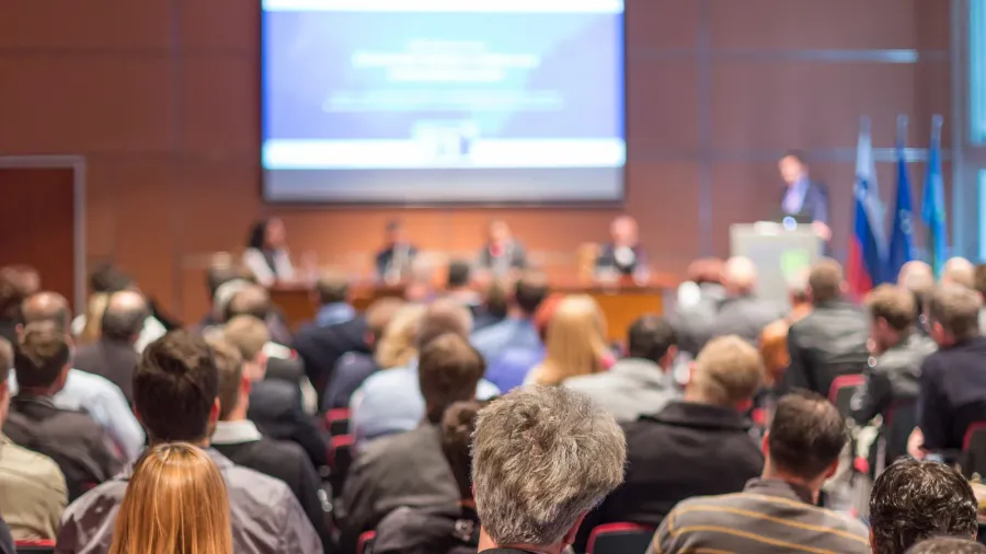 speaker giving presentation on scientific business conference