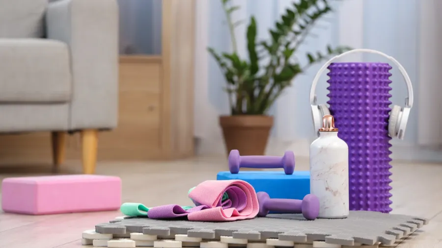 sports equipment with headphones on mat in living room